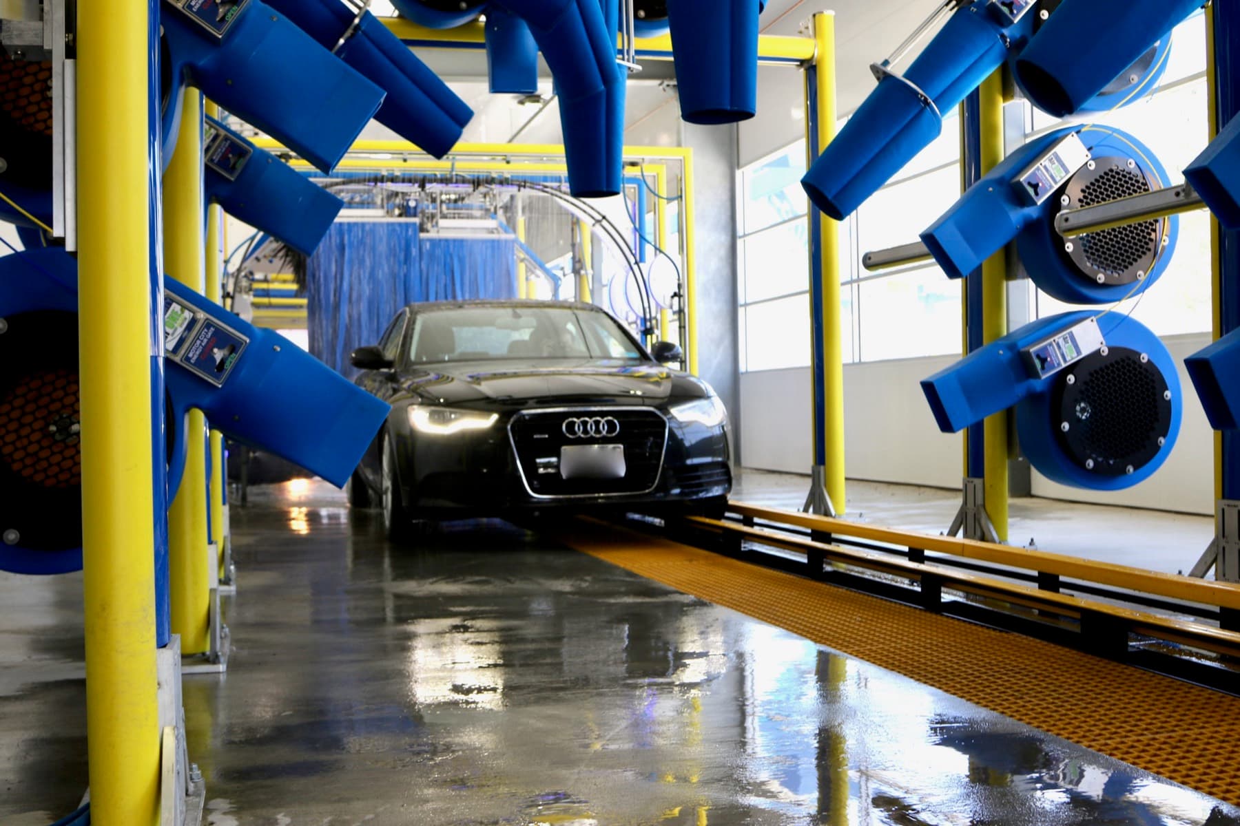 High-power air dryers finishing a car at the end of the tunnel
